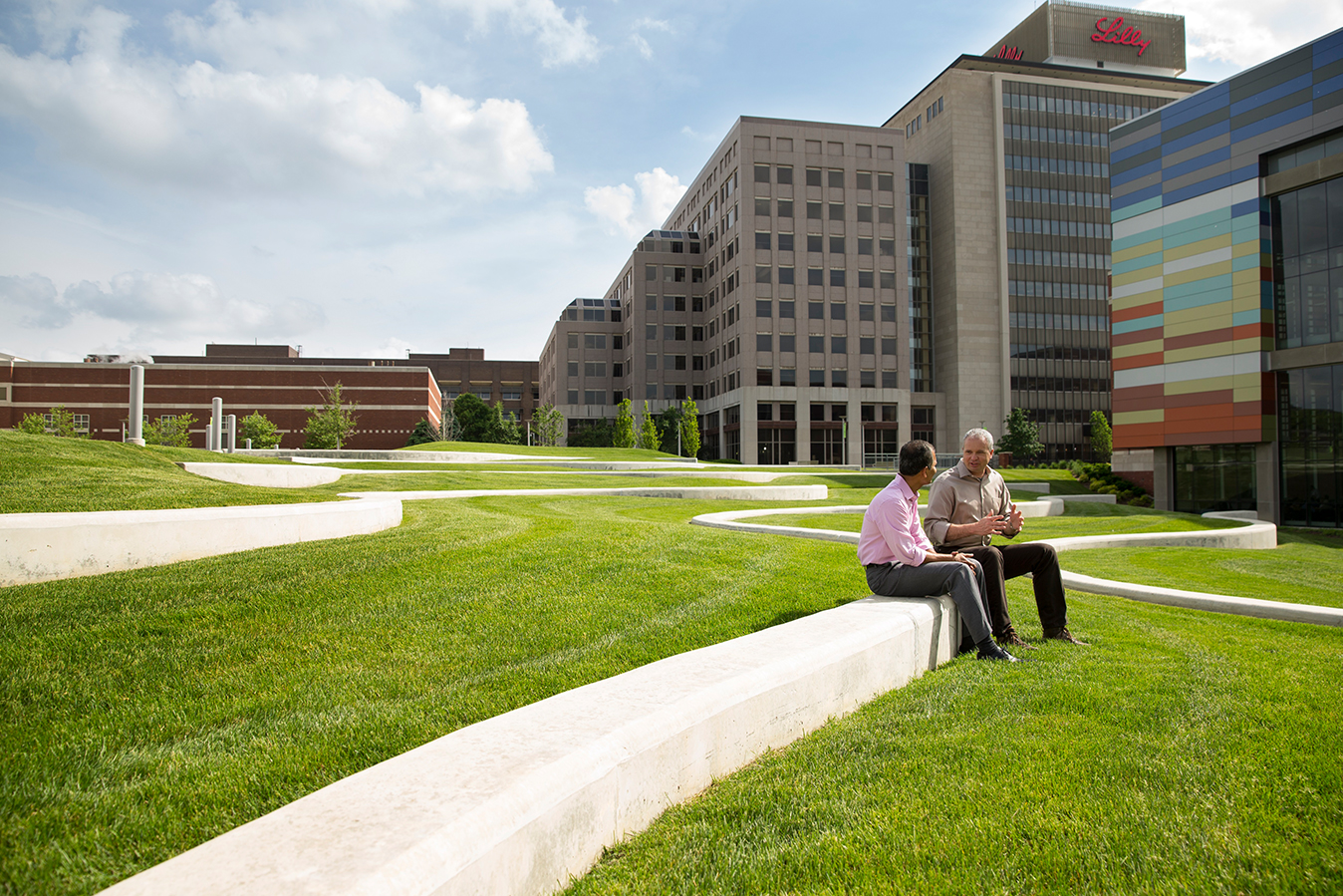 Two Lilly employees having a discussion outside of Lilly's Heritage Hall at the Lilly Corporate Center in Indianapolis