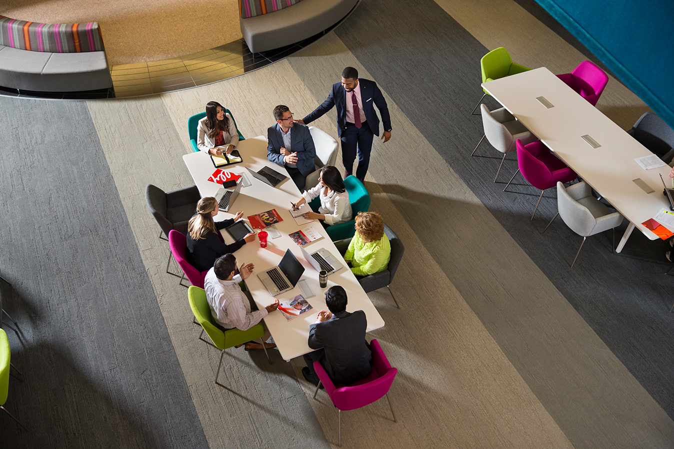 Lilly employees collaborating on a project in a conference room