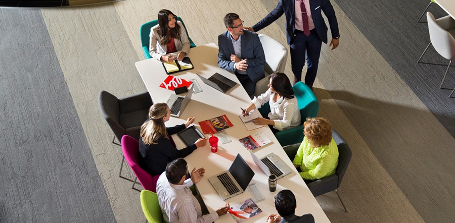 Lilly employees discussing key financial ratios in a conference room